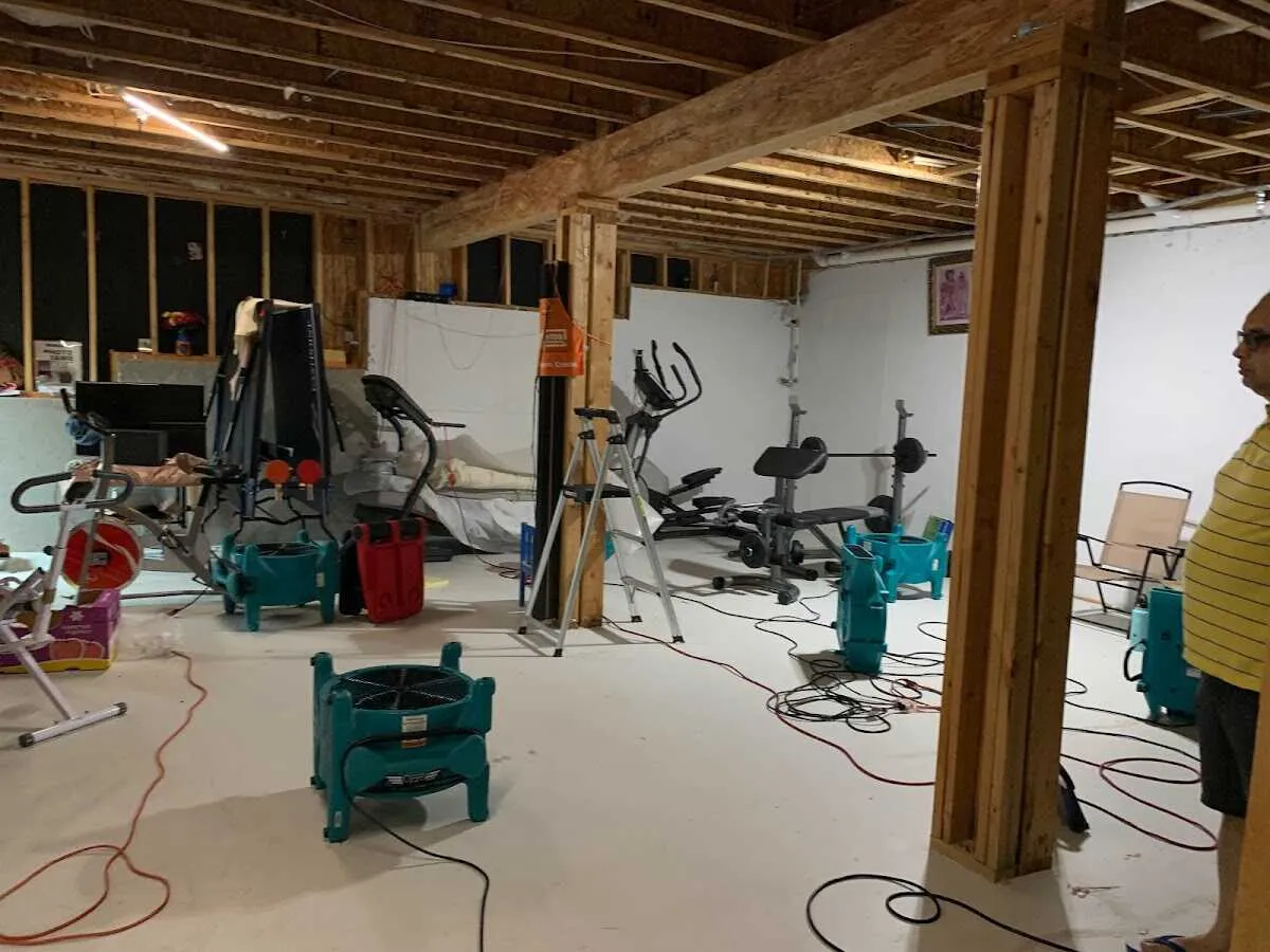 Basement drying equipment setup for Odor Removal & Deodorization in Quantico Base